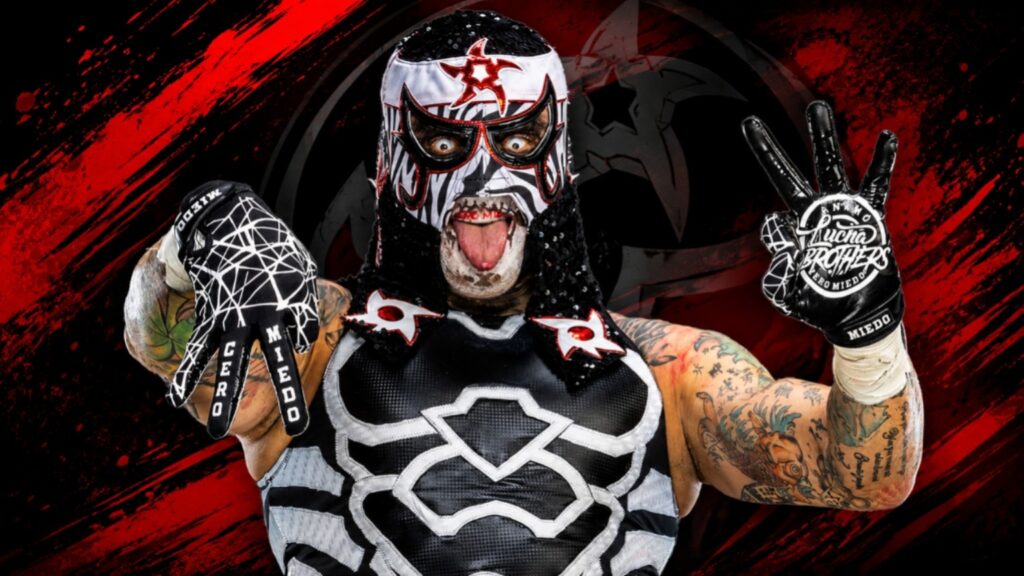 Penta performing his iconic Cero Miedo hand gesture in WWE, wearing his black, white, and red lucha mask against a dramatic red-and-black background.