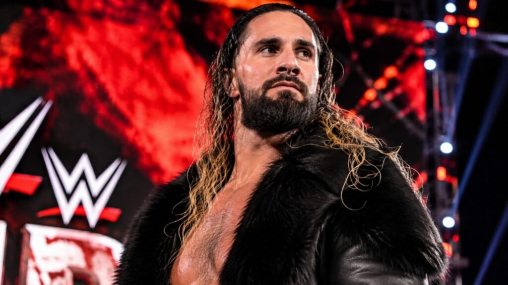 Seth Rollins making his WWE entrance in a black fur coat with an intense expression, standing under dramatic red arena lighting for a cinematic wrestling thumbnail.