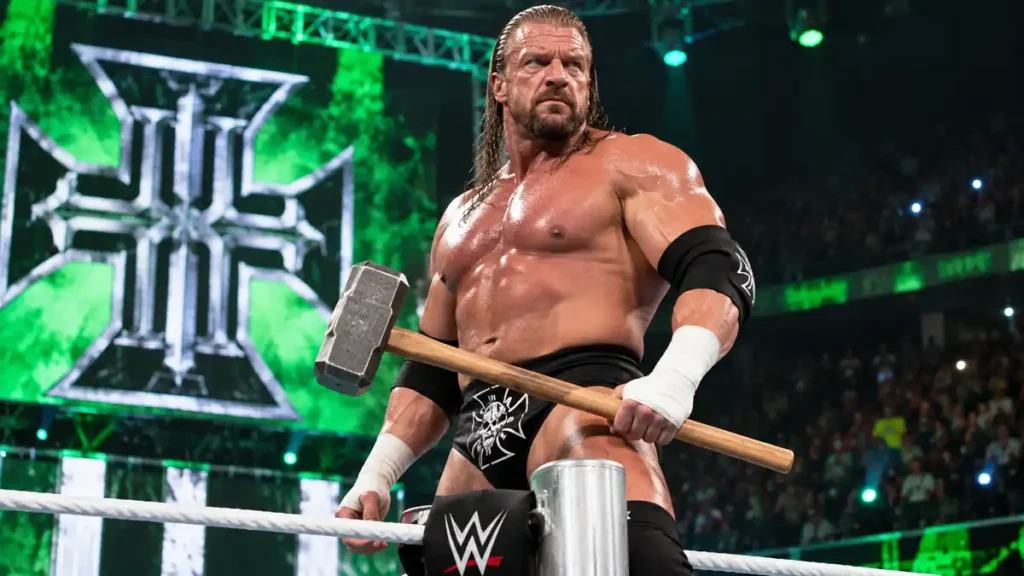 Triple H holding his signature sledgehammer weapon during a WWE entrance