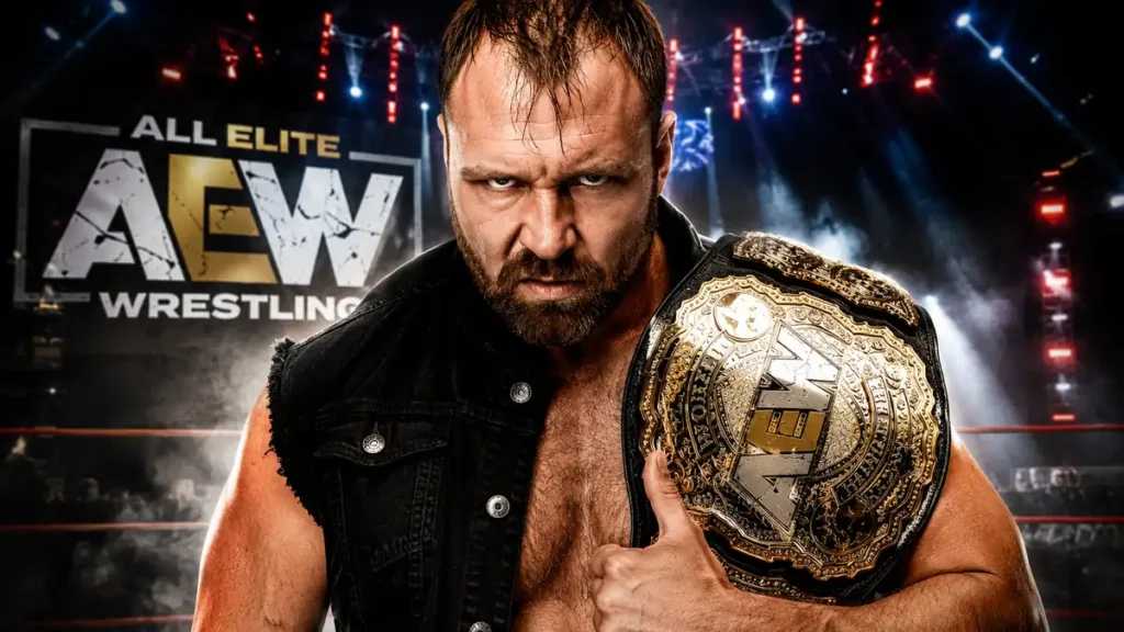 Jon Moxley holding the AEW World Championship inside an AEW arena during his record-setting run as a four-time AEW World Champion.