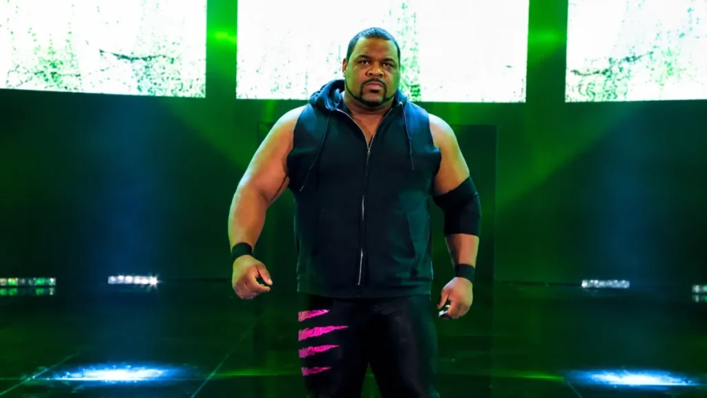 Keith Lee making his entrance during a WWE event, showcasing his powerful presence before a match.