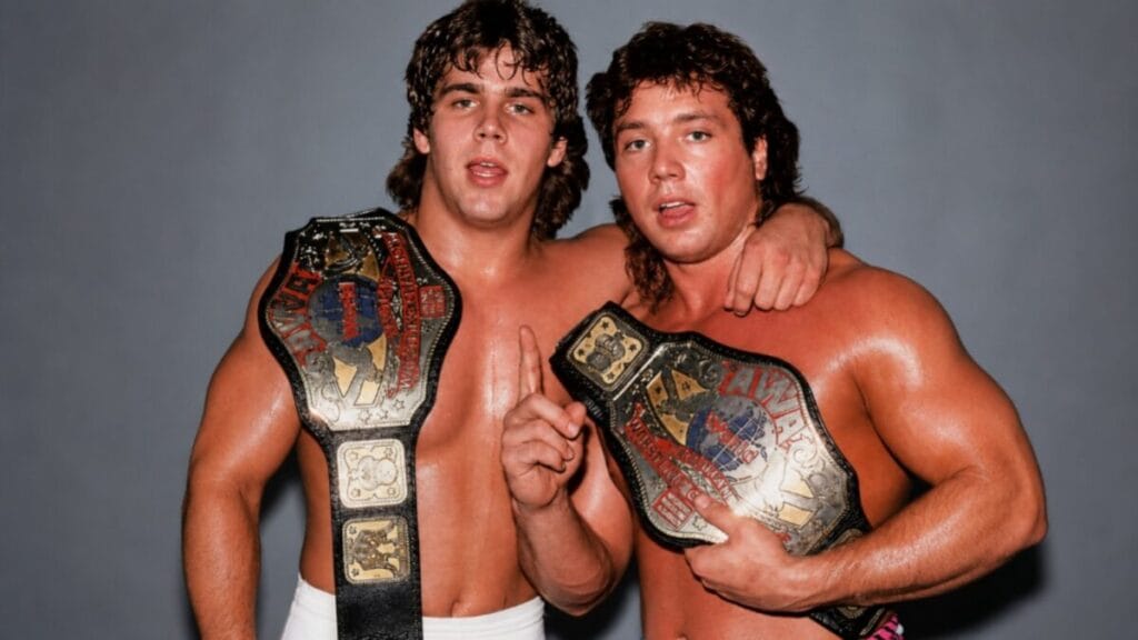 The Rockers Shawn Michaels and Marty Jannetty posing with the WWF World Tag Team Championship belts during their early wrestling career.