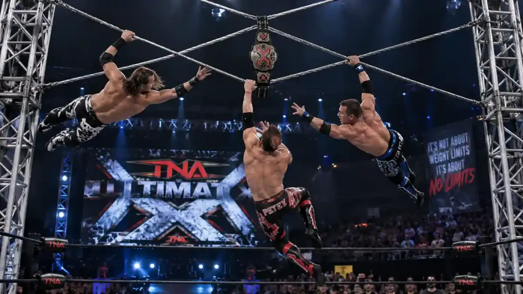 Classic TNA Ultimate X match structure with wrestlers suspended on steel cables